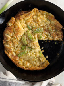 Overhead shot in cast iron pan of Savory Dutch Popover