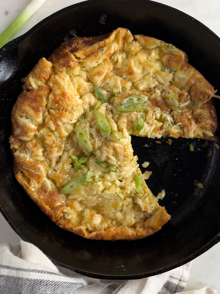 Overhead shot in cast iron pan of Savory Dutch Popover